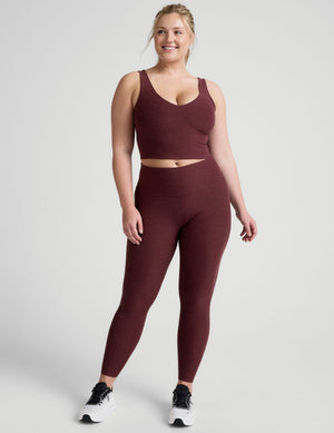 red high-waisted midi length leggings. 