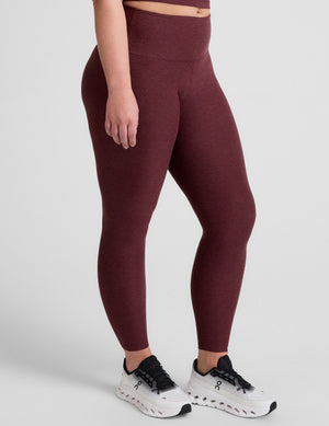 red high-waisted midi length leggings. 