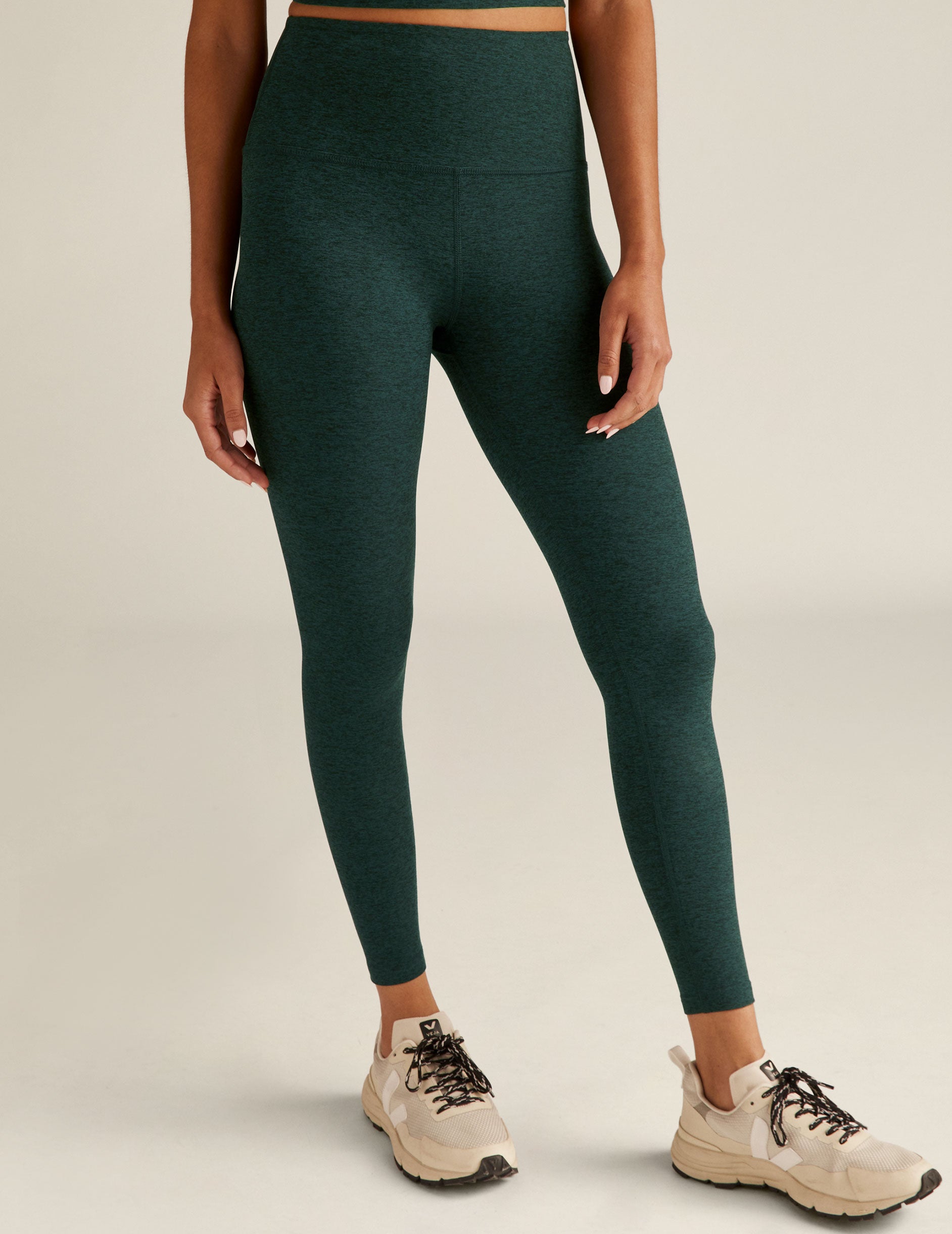 green high-waisted midi leggings. 