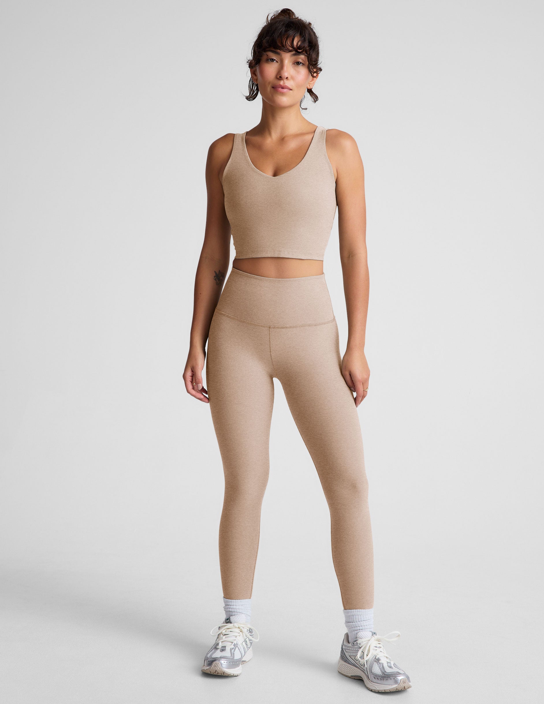 brown high-waisted midi length leggings. 