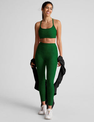 green high-waisted midi length leggings with a 24