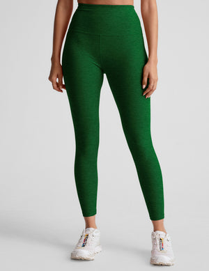 green high-waisted midi length leggings with a 24