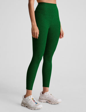 green high-waisted midi length leggings with a 24