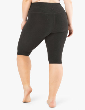 Rear view of dark gray marled Spacedye Pedal Pusher High Waisted Legging showing the high waist and below-the-knee fit.