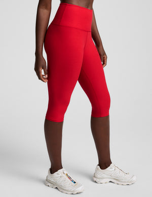red high-waisted pedal pusher length leggings. 