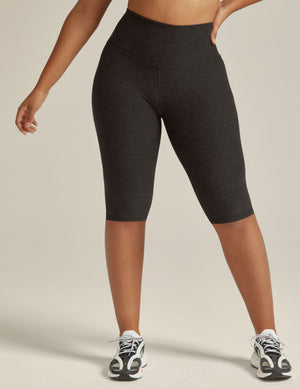 Dark gray marled Spacedye Pedal Pusher High Waisted Legging, knee-length, high-rise, worn with white sneakers.