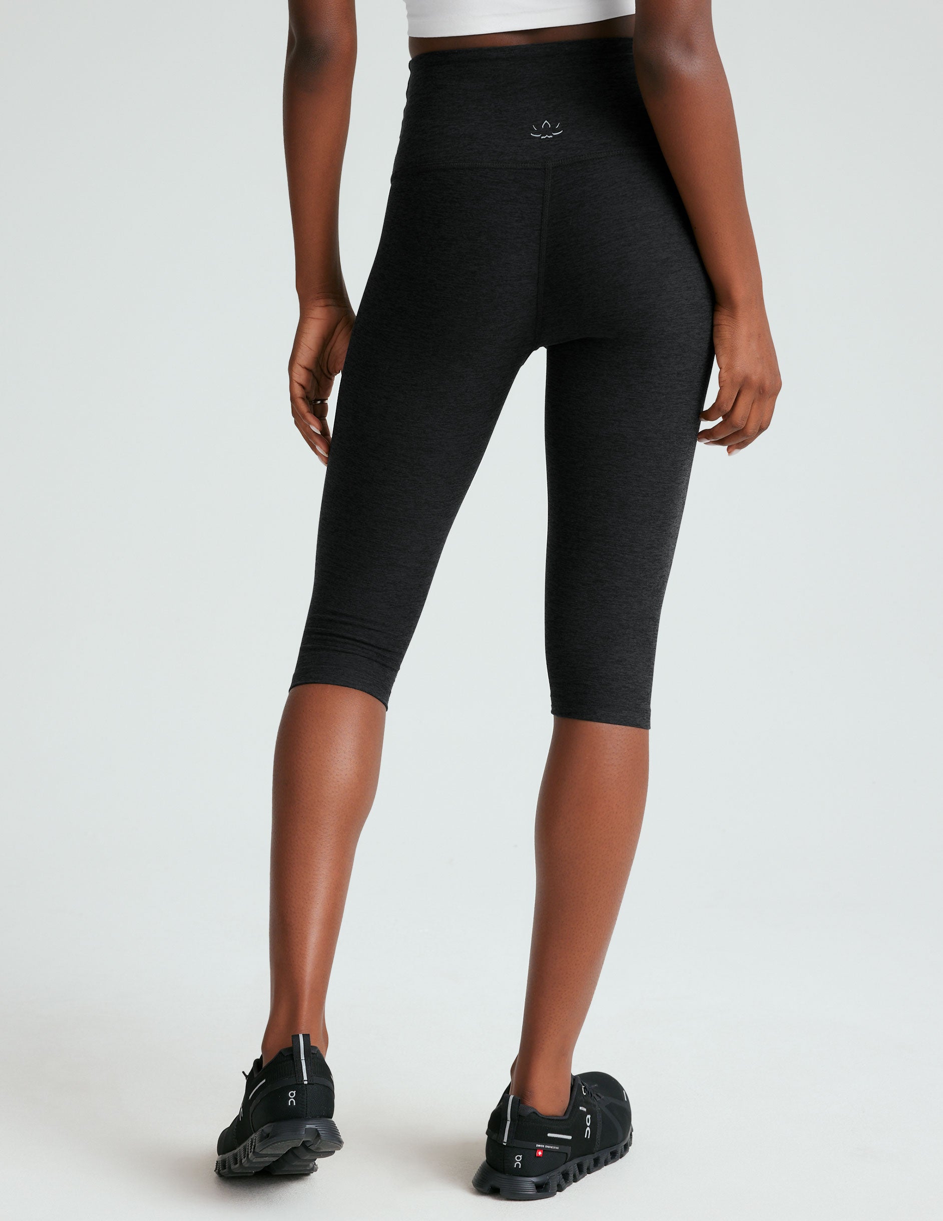 black high-waisted pedal pusher length legging. 