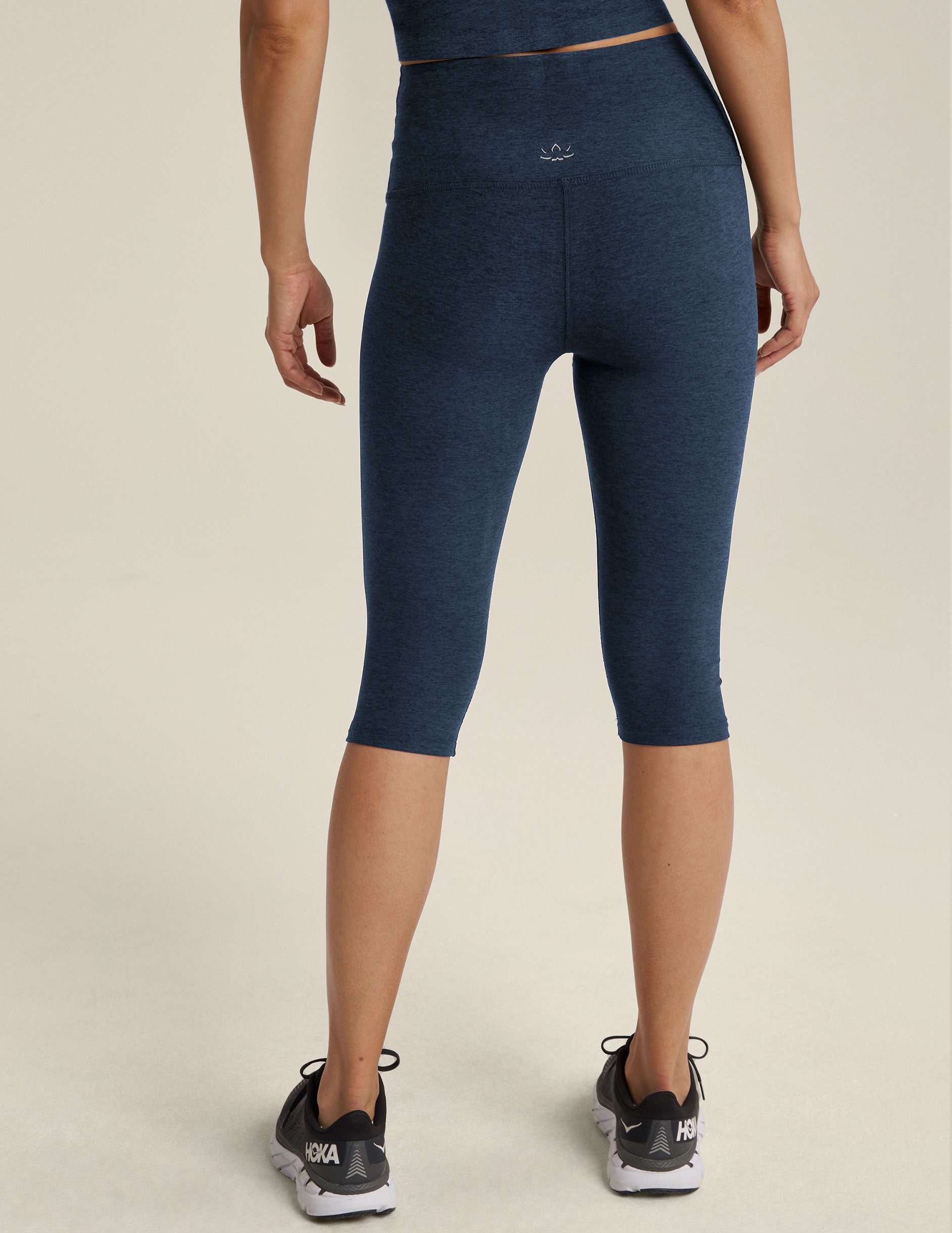 blue high-waisted pedal pusher length leggings. 