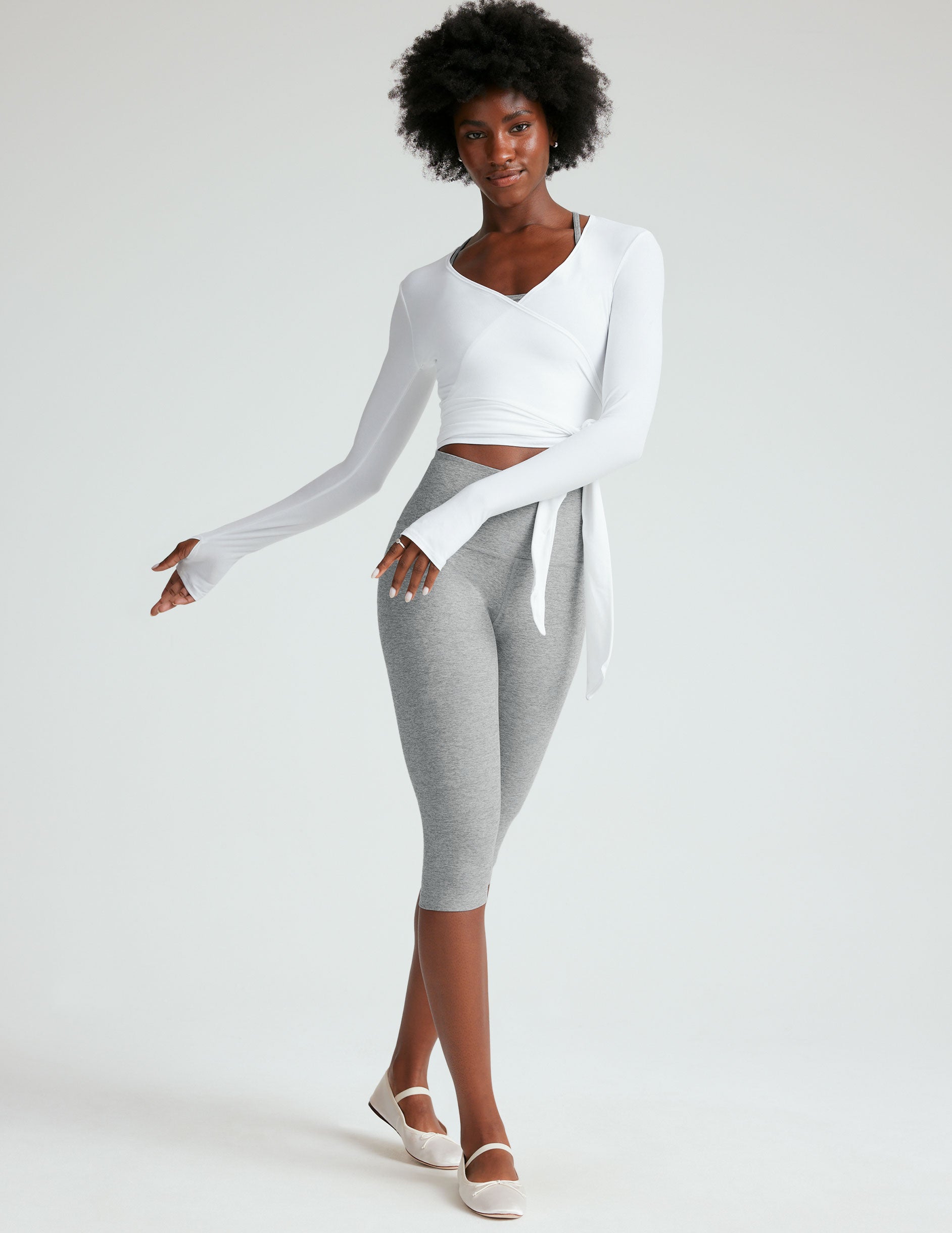 gray high-waisted pedal pusher length leggings.