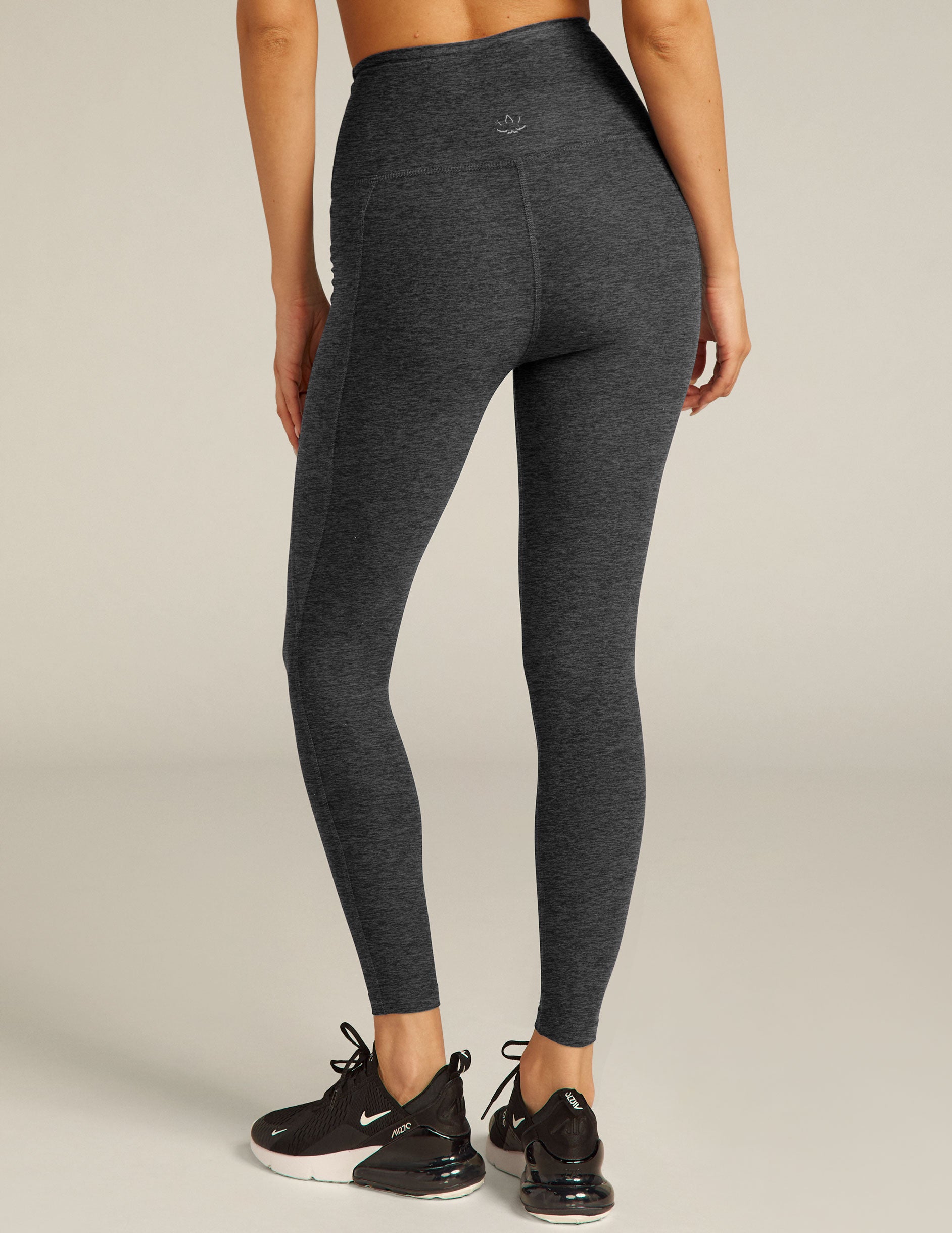black charcoal high-waisted midi leggings with pockets. 