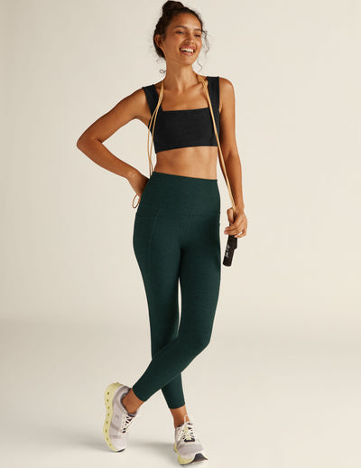 green high-waisted midi leggings with pockets. 
