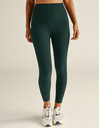 green high-waisted midi leggings with pockets. 