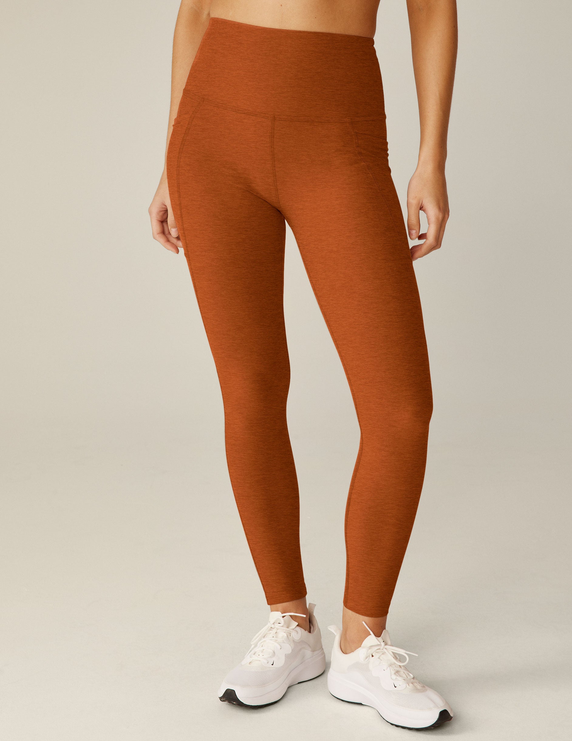 brown high-waisted midi leggings with pockets. 