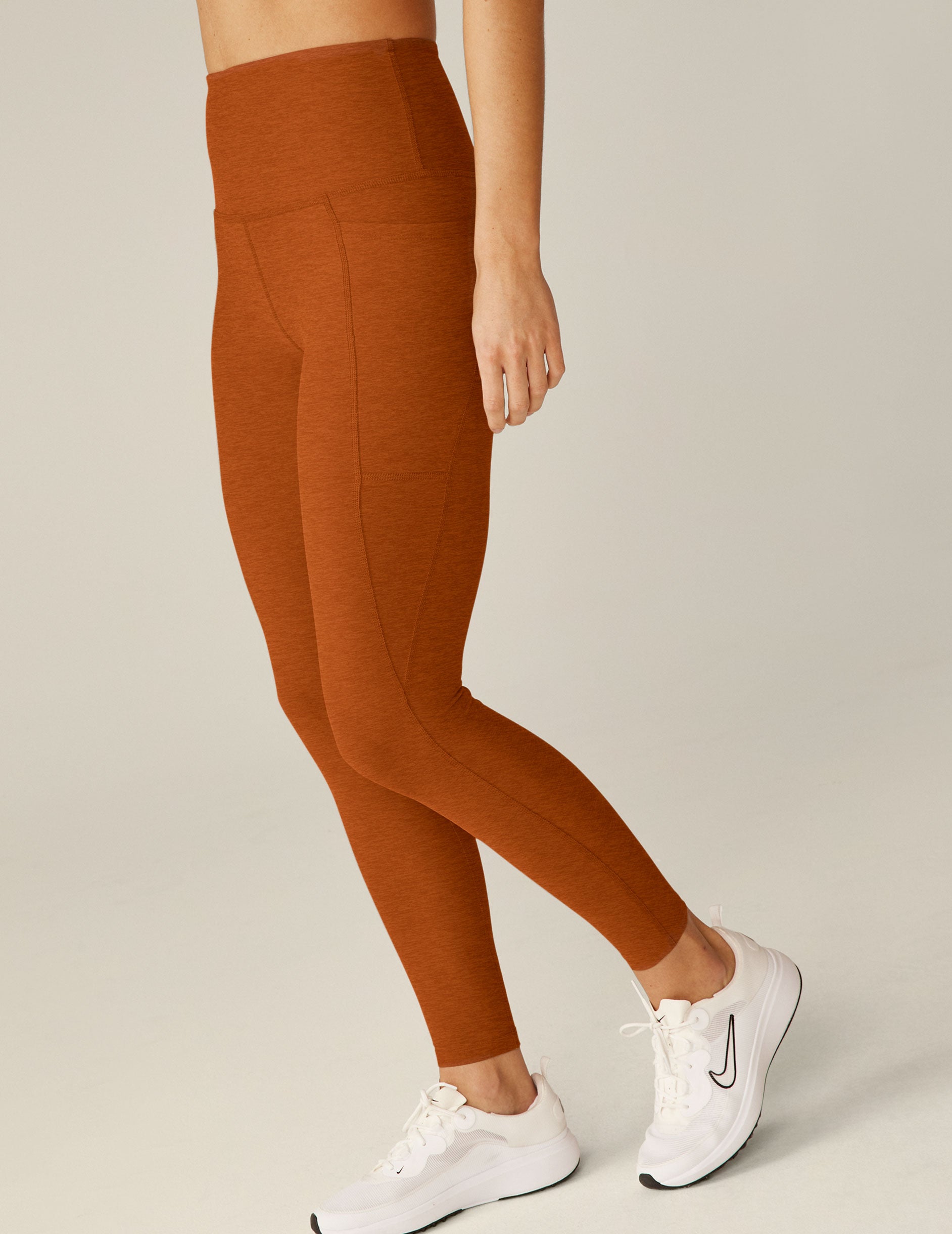 brown high-waisted midi leggings with pockets. 
