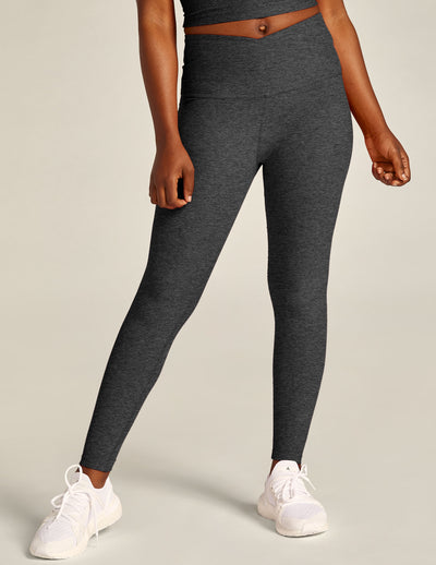 black-charcoal high-waisted midi legging with a crossover detail on the front waistband. 