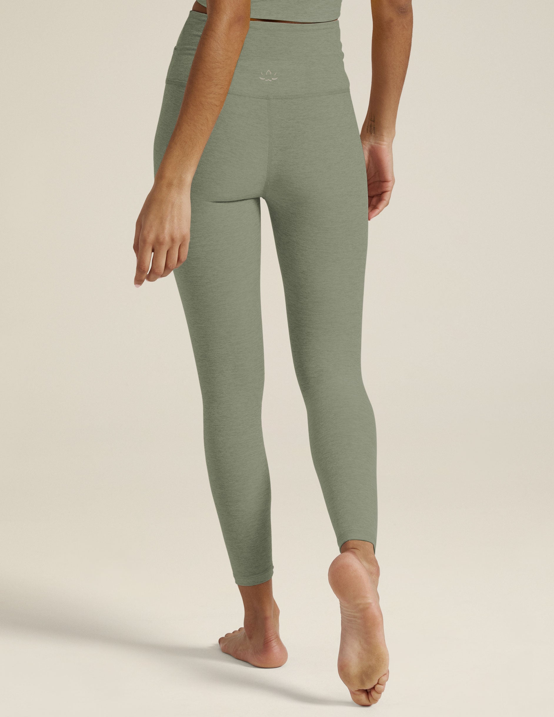 green midi leggings with crossover design on front waistband