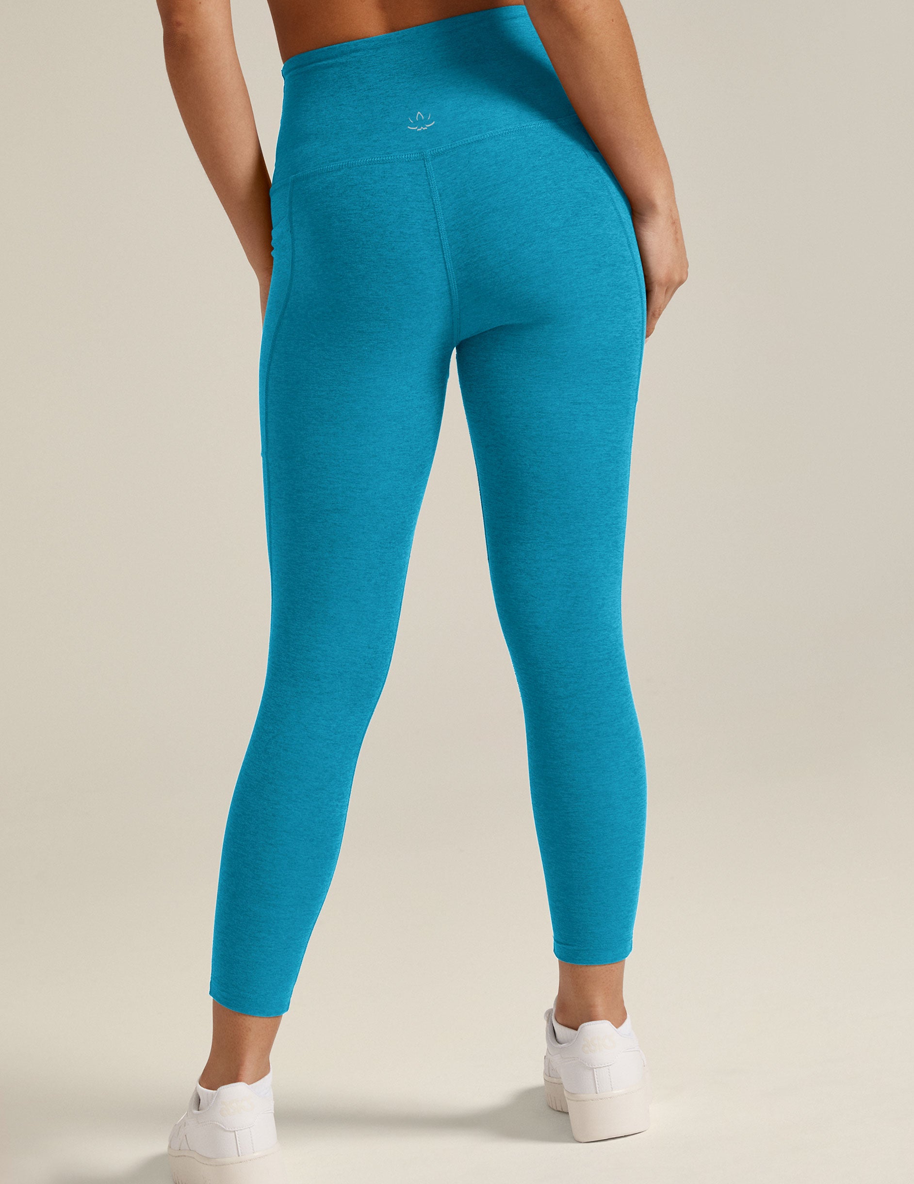 blue high-waisted capri spacedye leggings with side pockets. 
