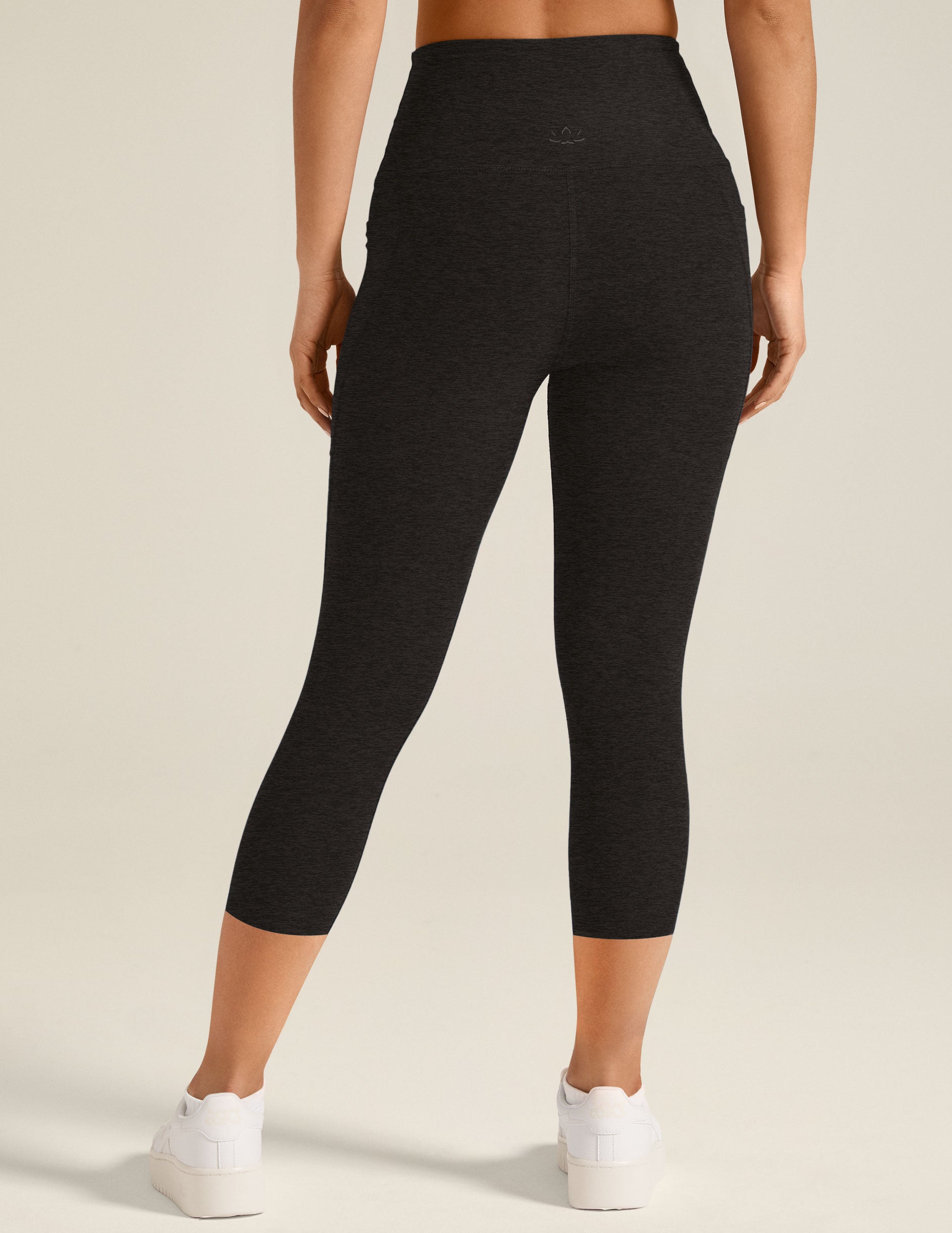 black capri midi legging with pockets at sides.