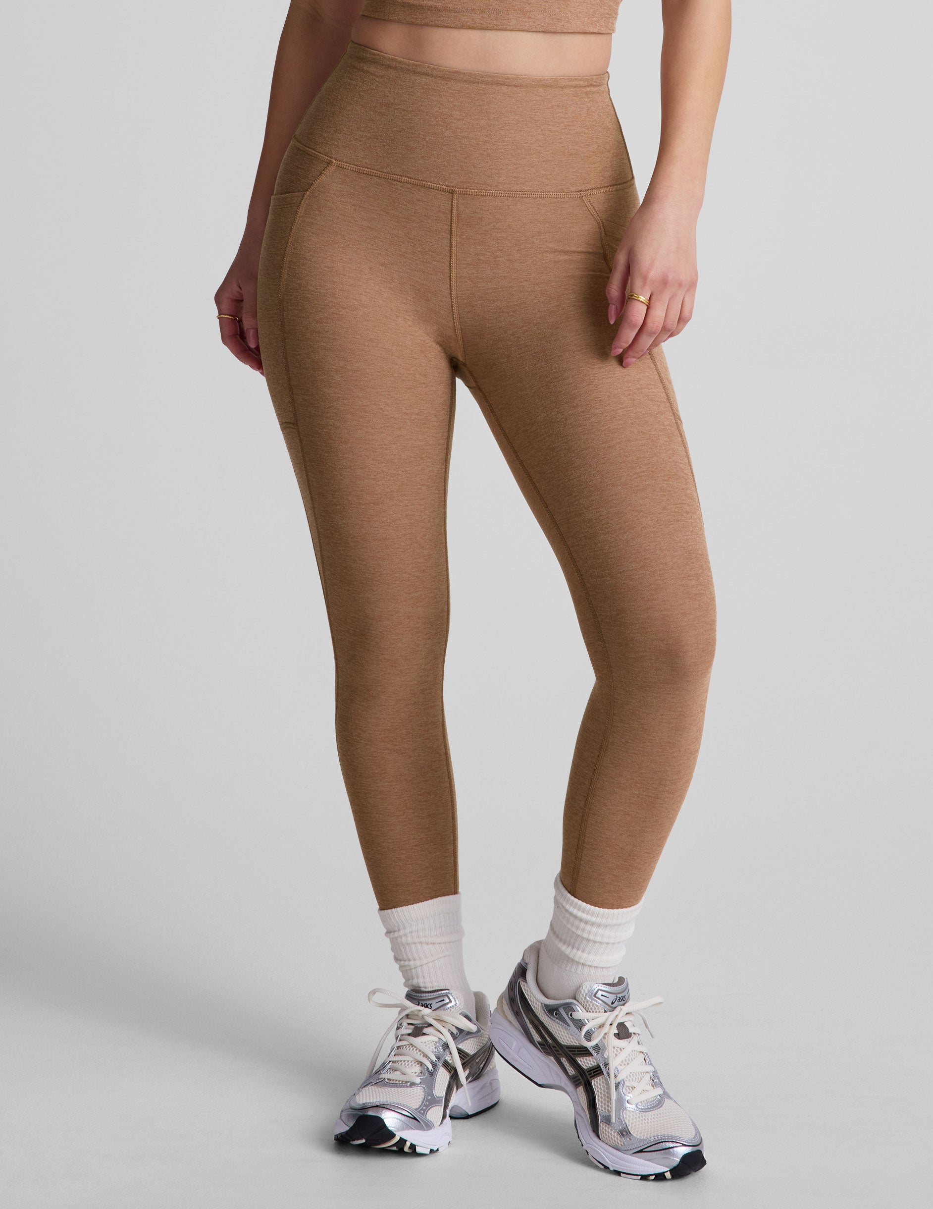 brown high-waisted capri length leggings with pockets. 