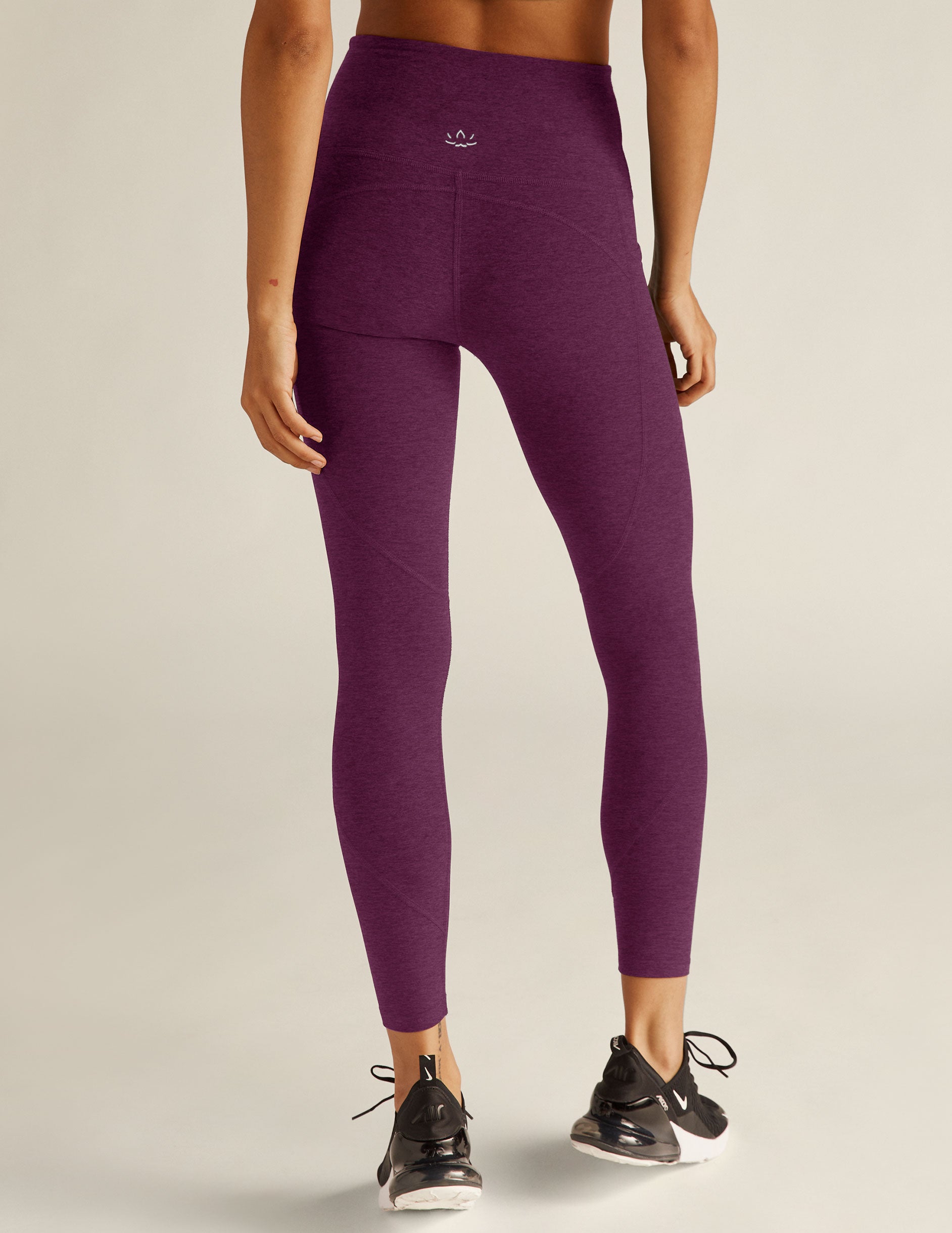 purple high-waisted midi leggings with side pockets. 
