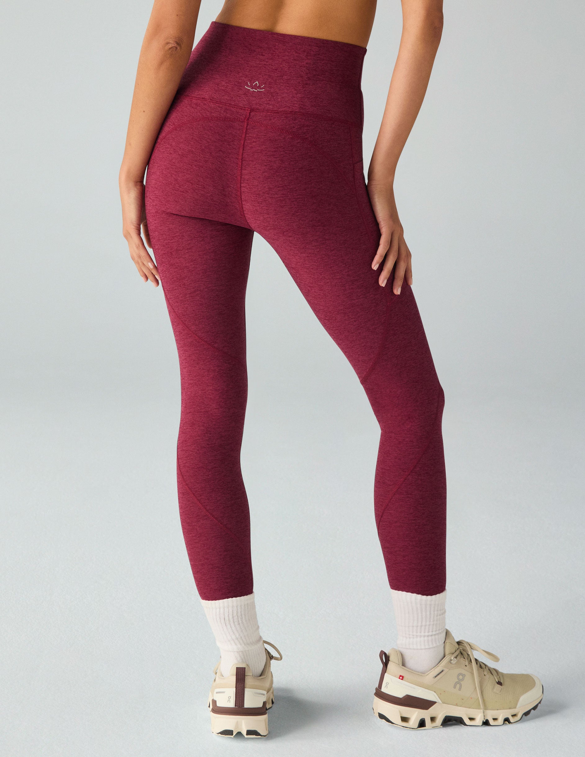 red high-waisted midi leggings with side pockets. 