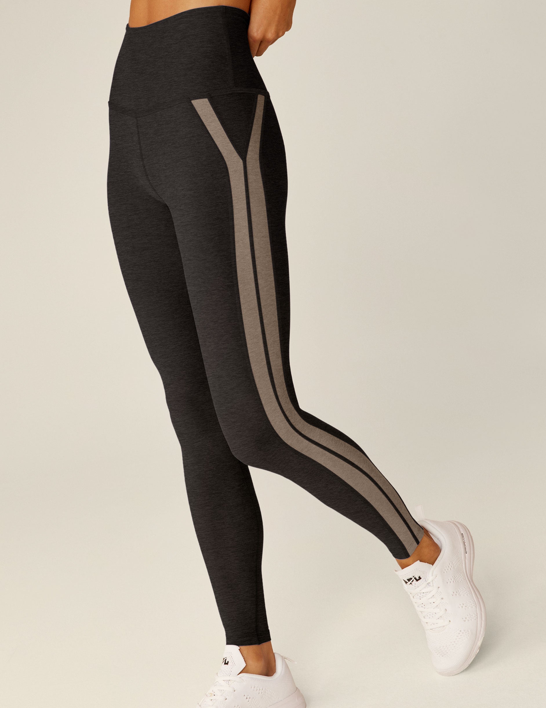black high-waisted midi leggings with brown lining. 