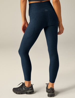 blue high-waisted midi leggings with a drawstring at waistband and side pockets. 