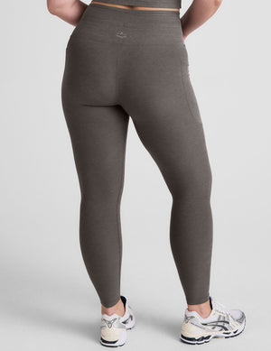 gray high-waisted midi length leggings with a drawstring at waistband and side pockets. 