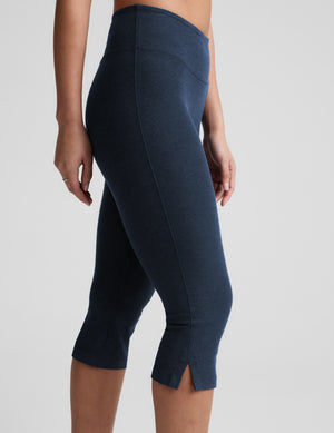 Side view of Navy Spacedye Mid-Rise Slit Pedal Pusher Legging featuring a wide waistband and small slits at the mid-calf hem.