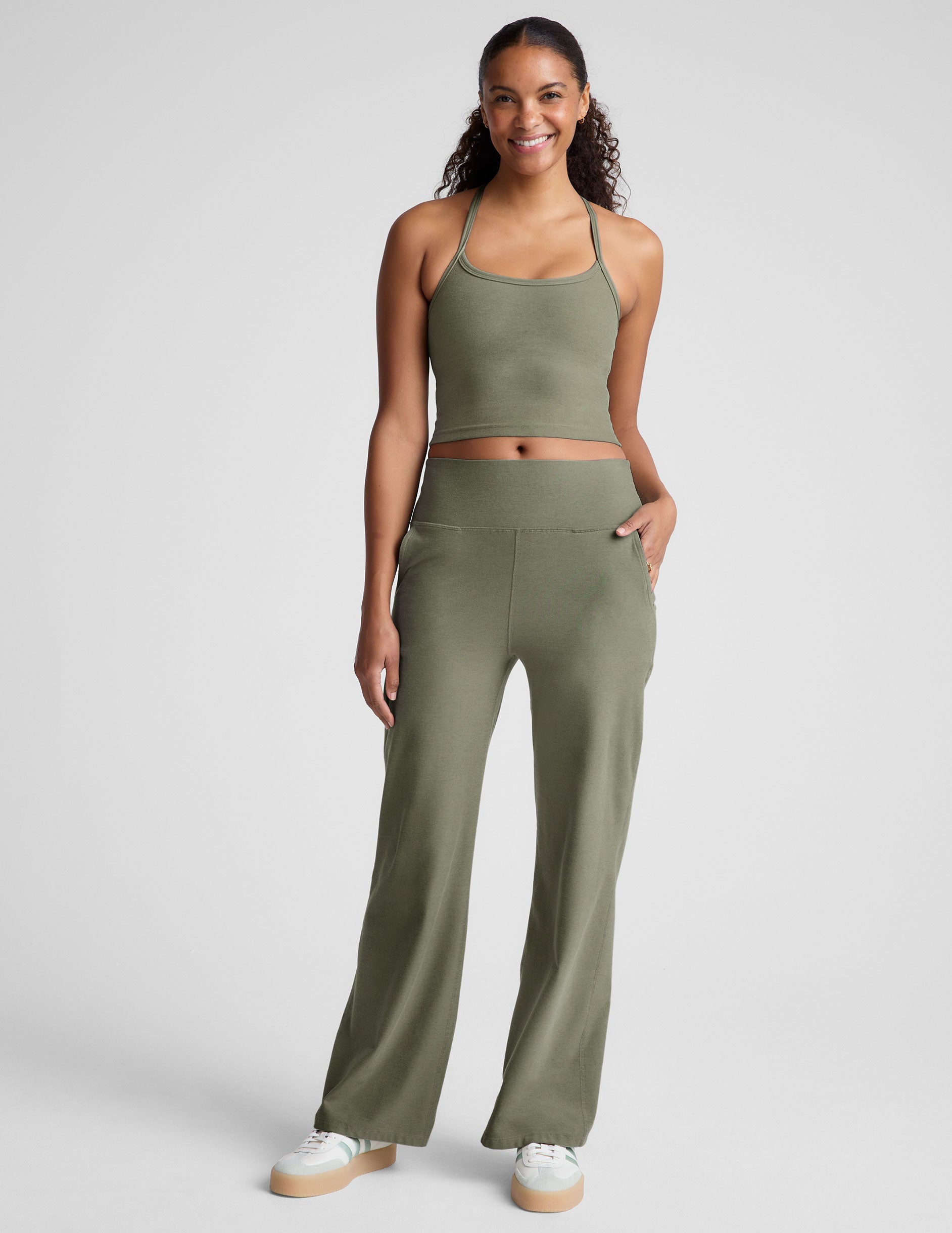 green racerback cropped tank top with thin straps. 