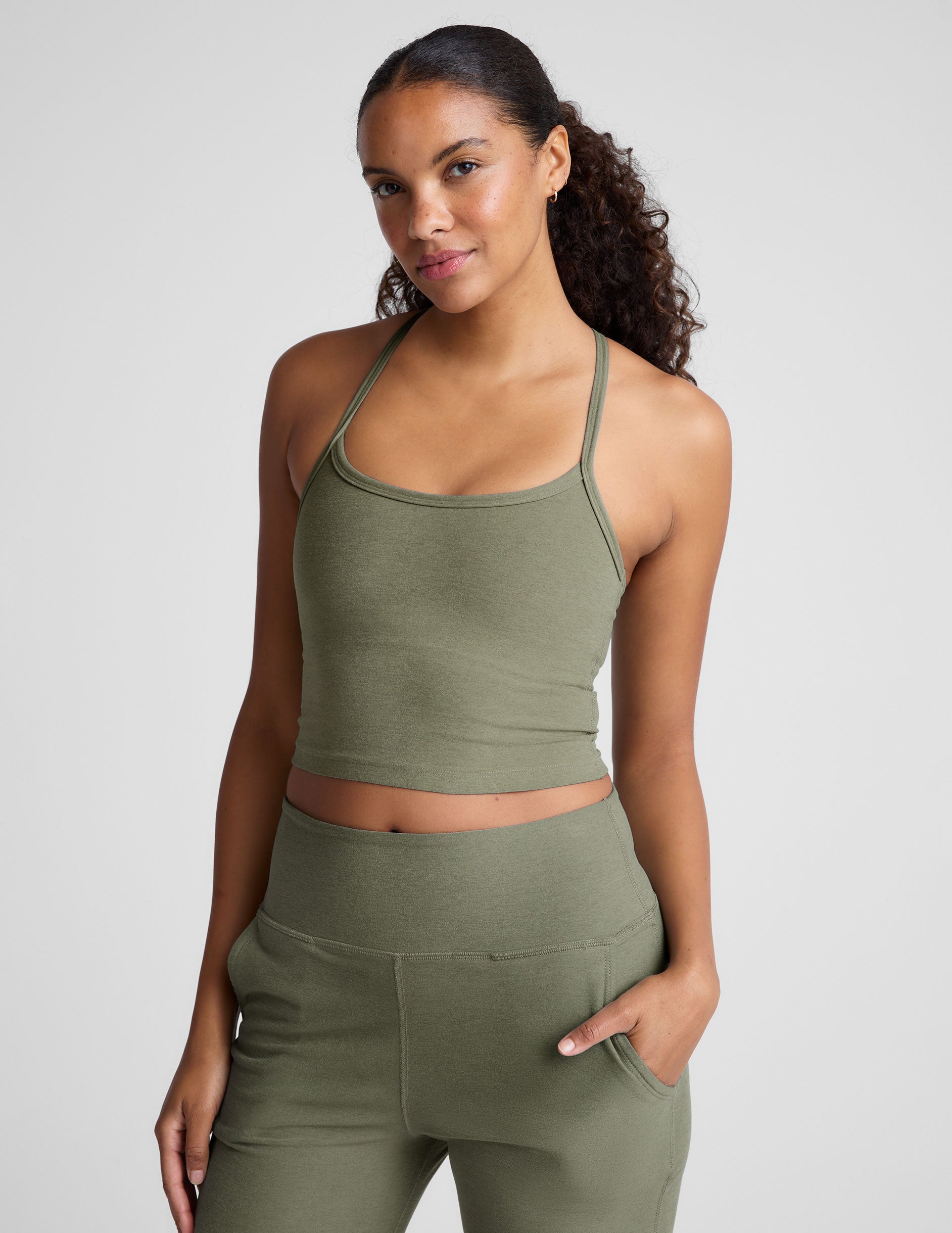 green racerback cropped tank top with thin straps. 