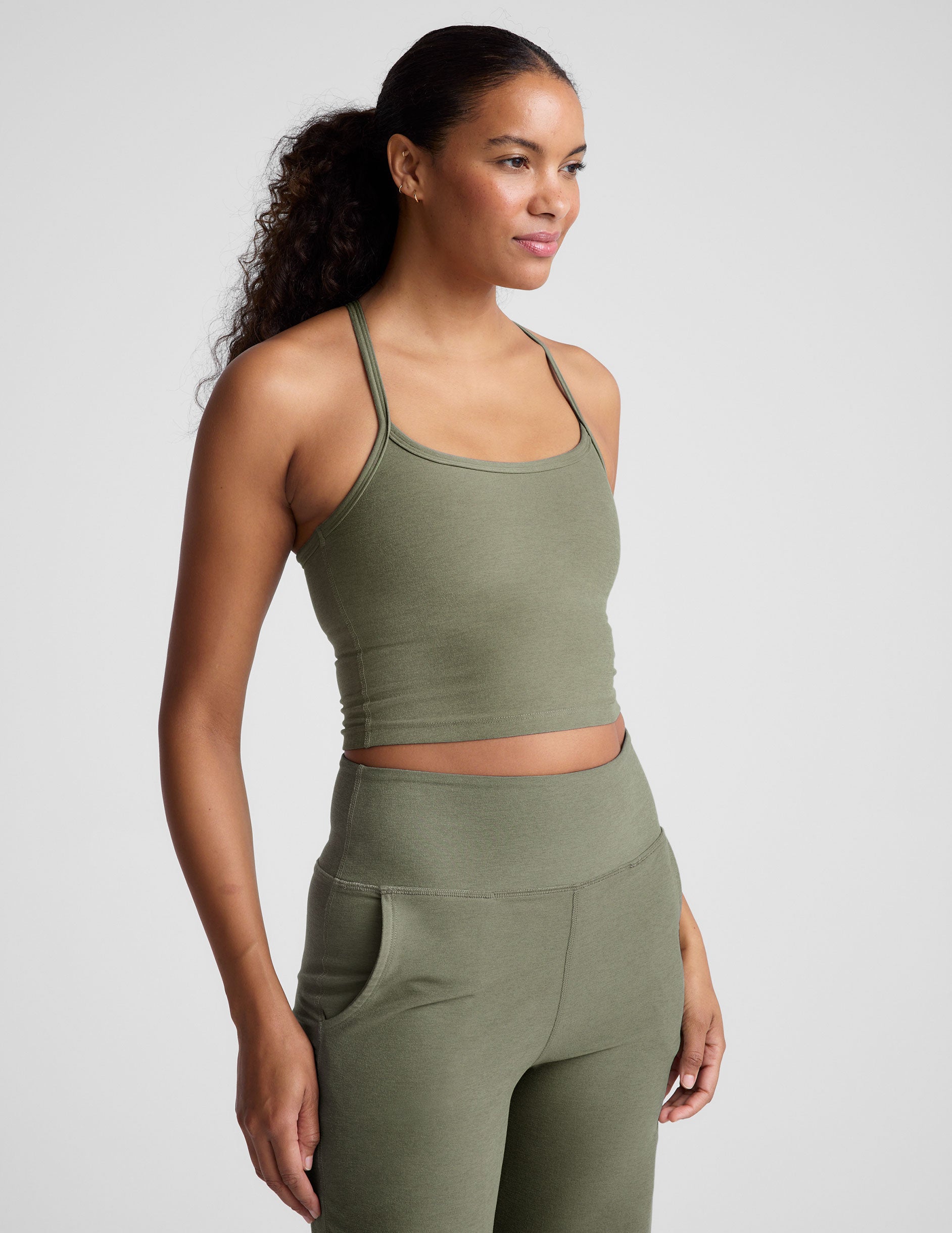 green racerback cropped tank top with thin straps. 