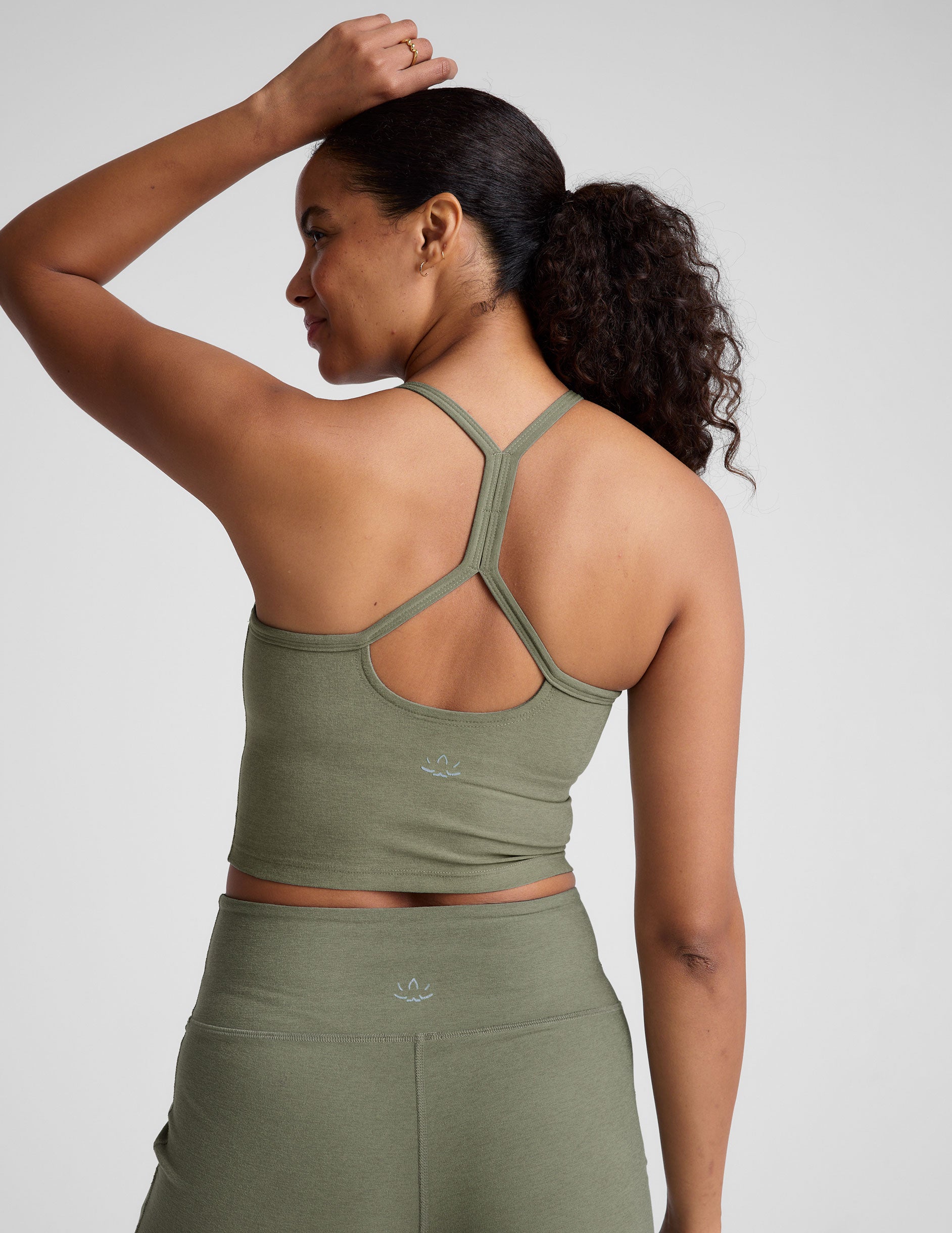 green racerback cropped tank top with thin straps. 