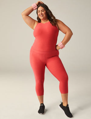plus size model is wearing pink crop top
