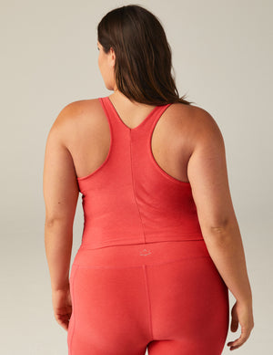 plus size model is wearing pink crop top