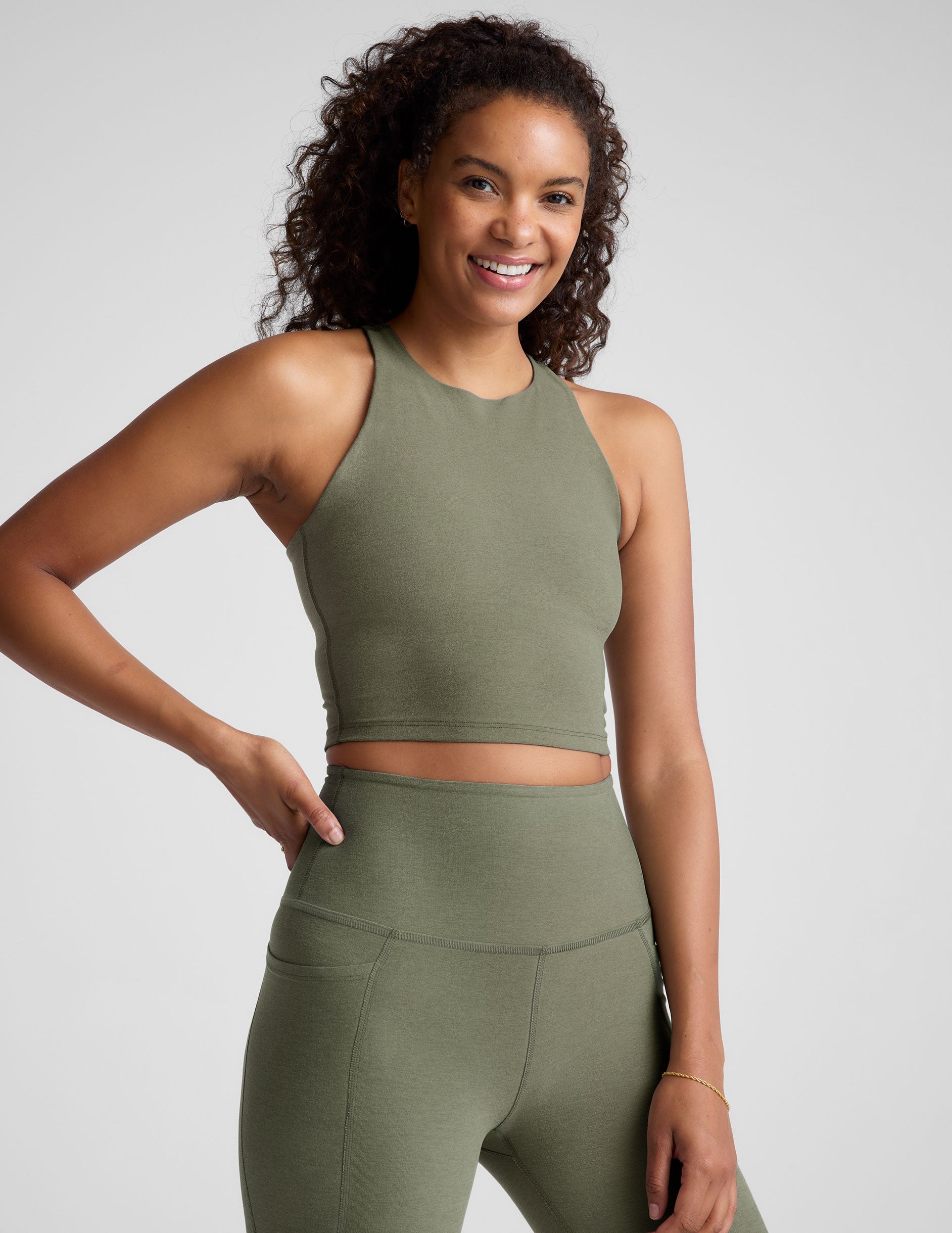 green racerback cropped tank with a high scoop neckline. 