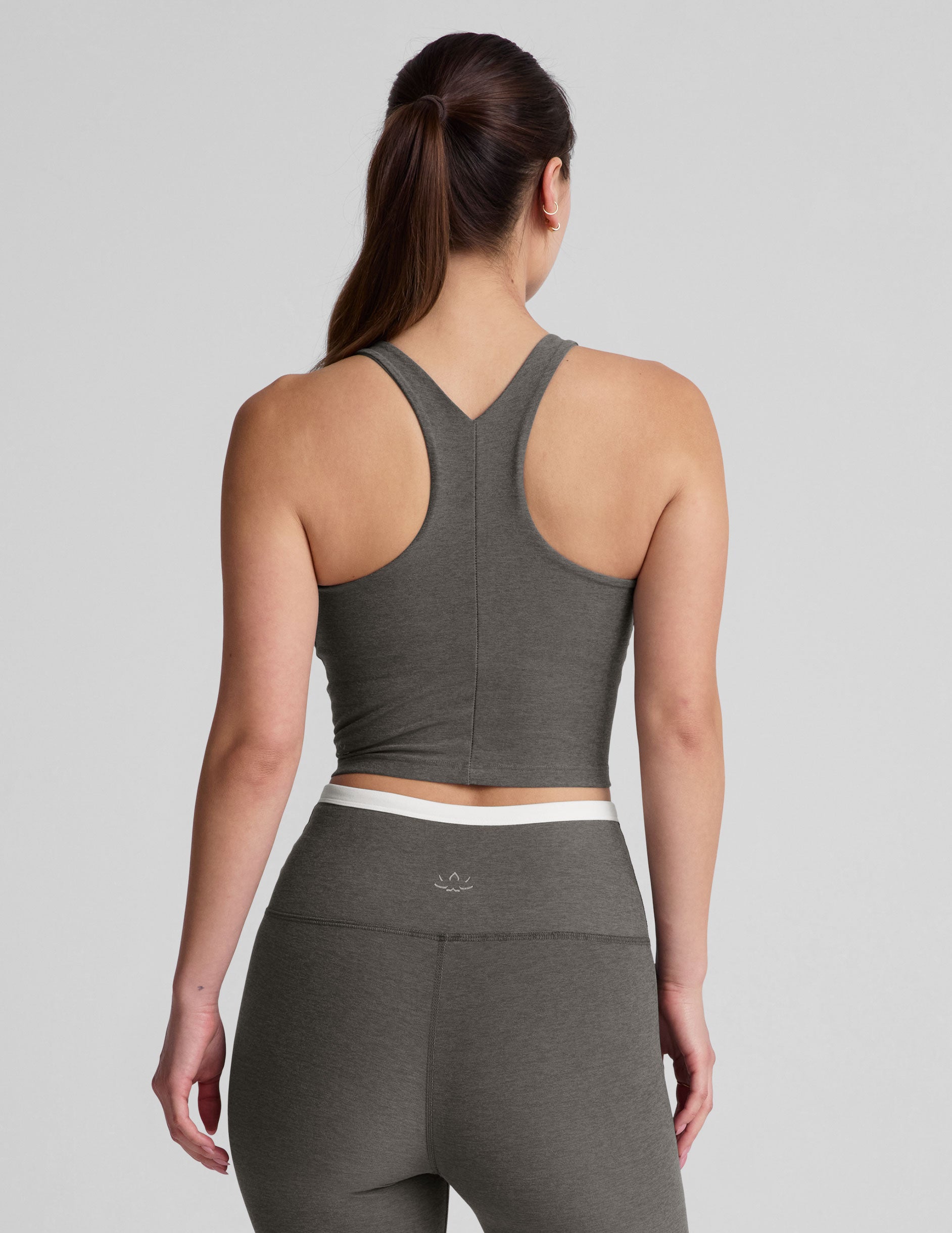 gray cropped tank top with a high scoop neckline. 