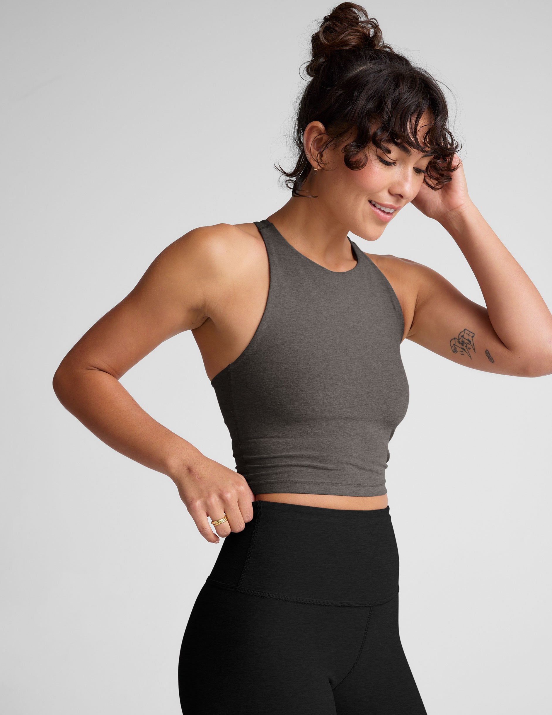 gray cropped tank top with a high scoop neckline. 