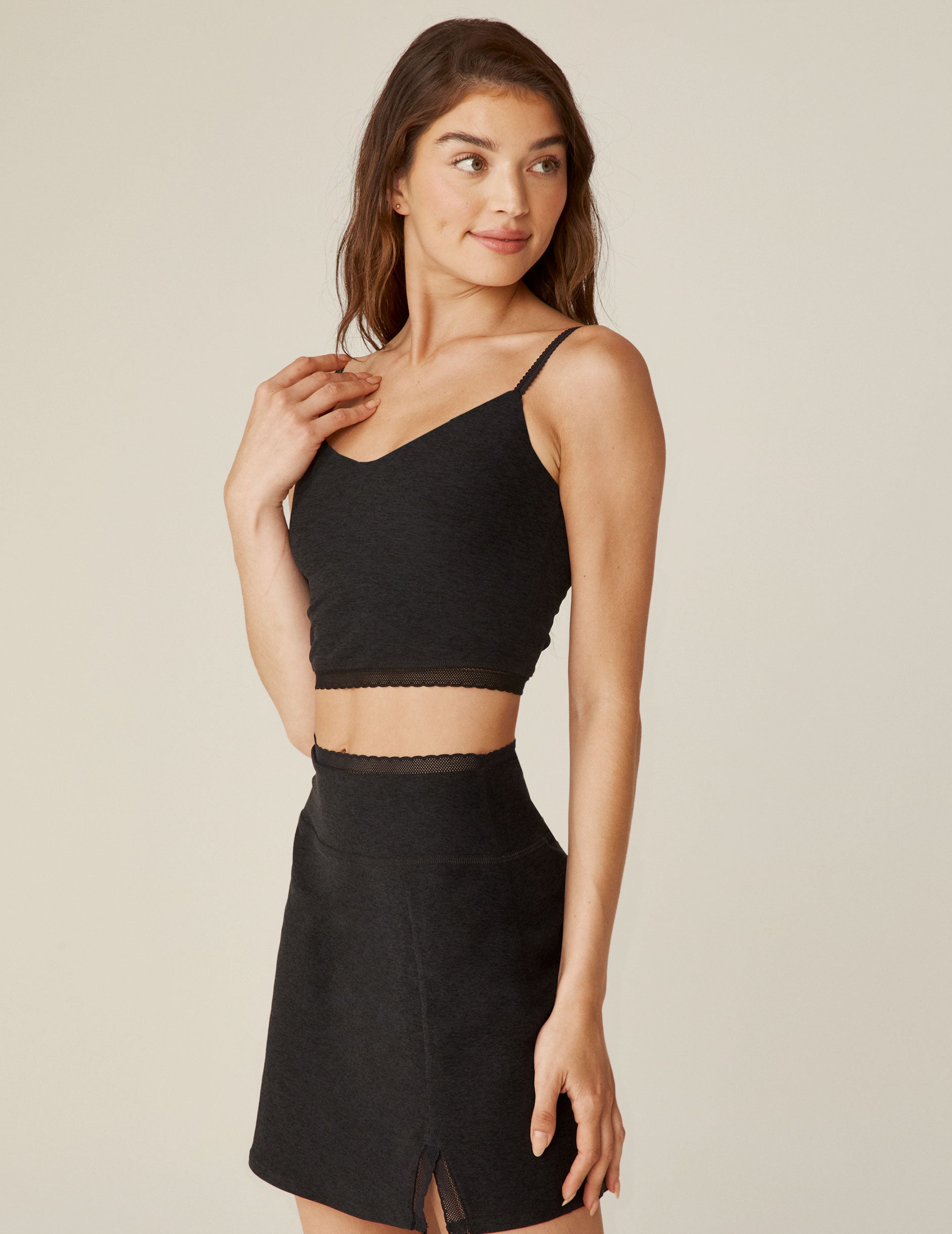 black v-neck cropped tank with lace trim. 