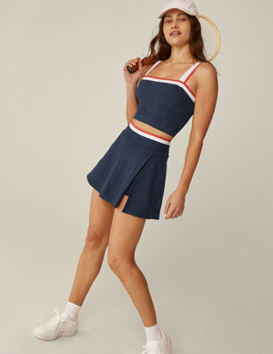 blue square neck cropped tank top with white and red stripes and outlining around the neckline. 