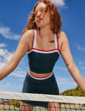 blue square neck cropped tank top with white and red stripes and outlining around the neckline. 