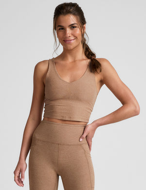 tan cropped tank top with a front and back v neckline. 