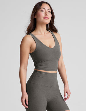 gray cropped length tank top with a front and back V neckline and self shelf bra. paired with high-waisted 5