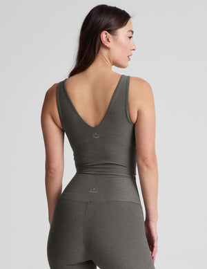 gray cropped length tank top with a front and back V neckline and self shelf bra. paired with high-waisted 5