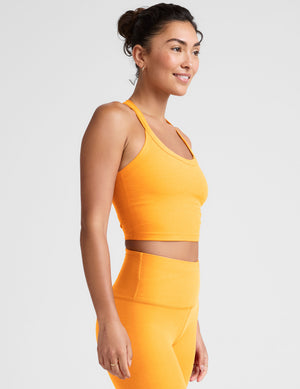 orange v-neck cropped tank with a high racerback. 