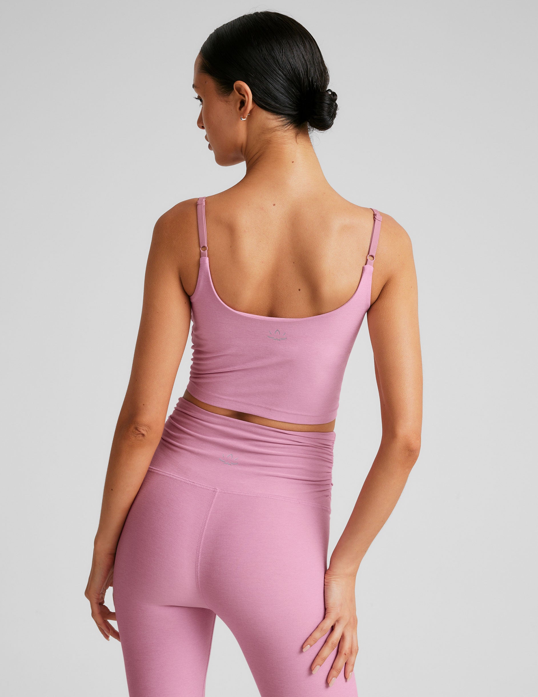 pink cropped tank with shirred detailing at center front, sweetheart neckline, and adjustable straps.