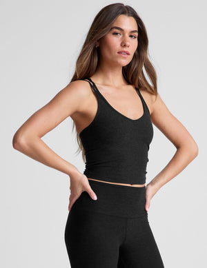 black waist length, V neckline​ tank top with a self shelf bra and criss-cross strap back detail​. 