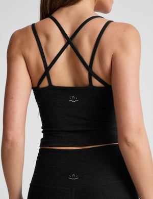 black waist length, V neckline​ tank top with a self shelf bra and criss-cross strap back detail​. 