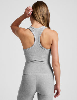 grey midway length racerback tank with white contrast trim. 