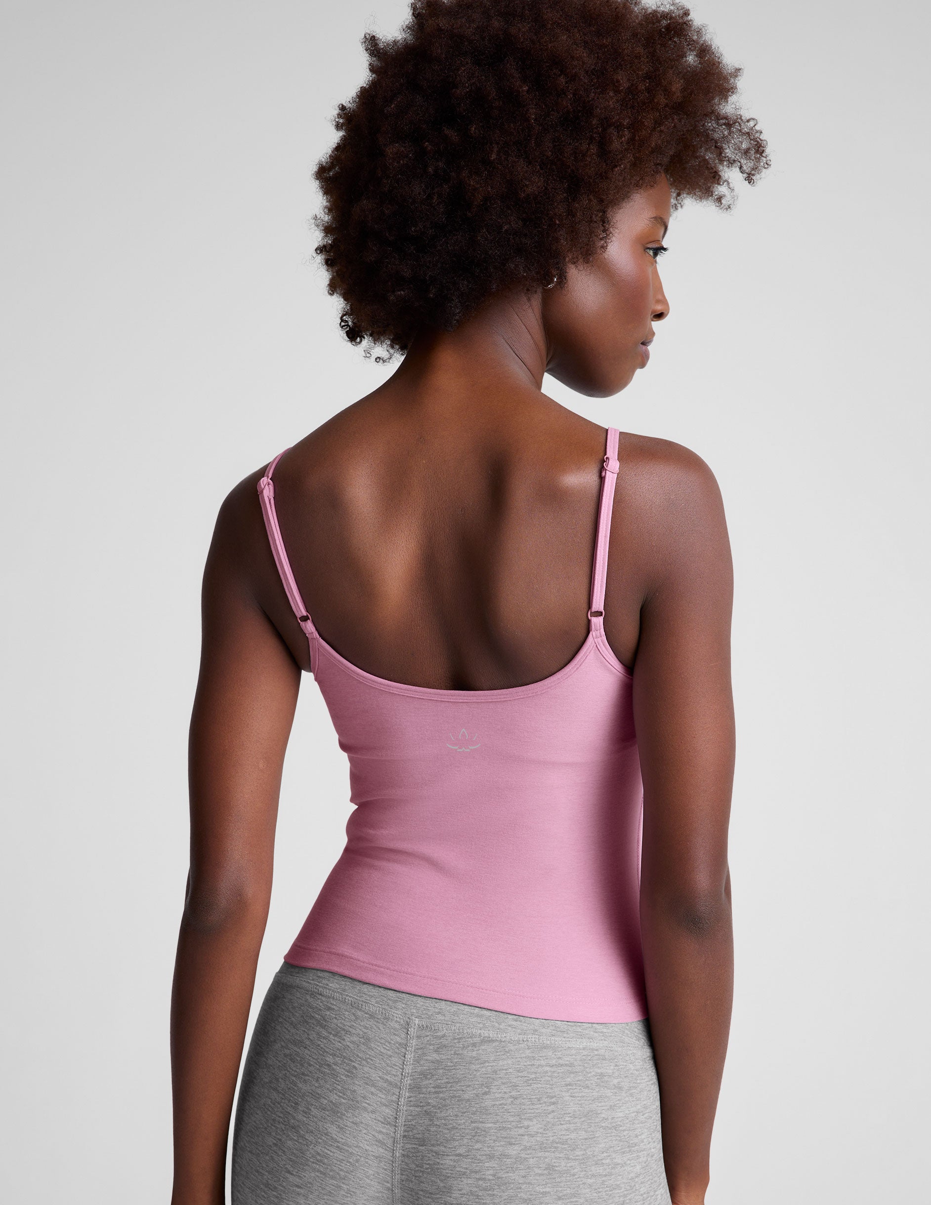 pink midway length tank with adjustable spaghetti straps. 